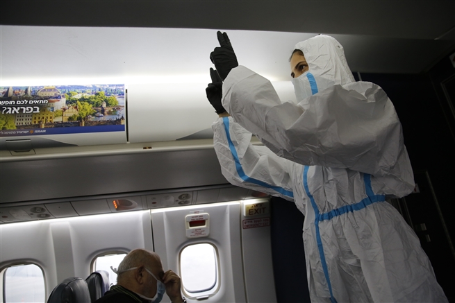 A stewardess wearing full PPE  Ben Gurion International Airport Israeli city of Tel Aviv to Eilat October 2020